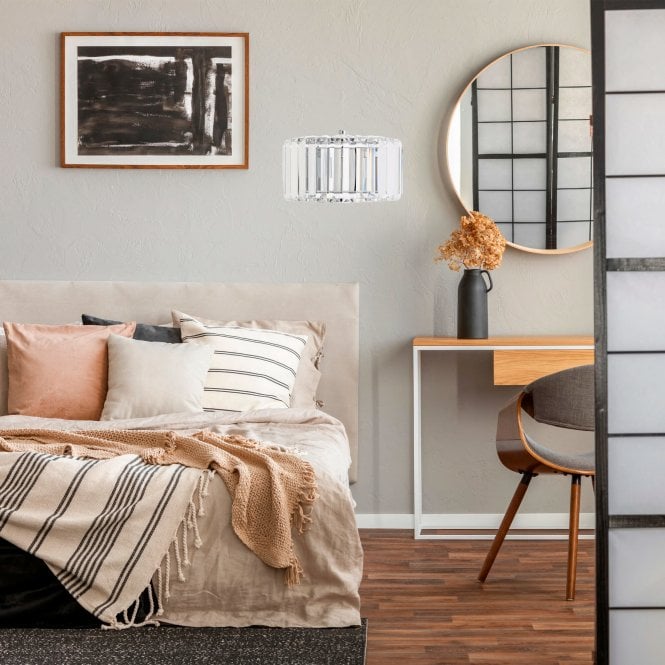 sofa and desk with mirror, picture frame and wall light