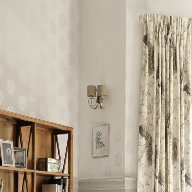 wall light above a picture next to curtains and a book case.