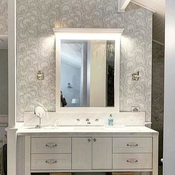 dressing table and large mirror with wall light either side.