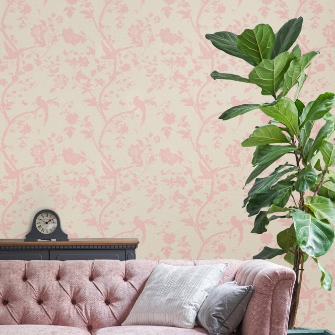 Laura Ashley wallpaper in the living room behind the sofa with a large plant  