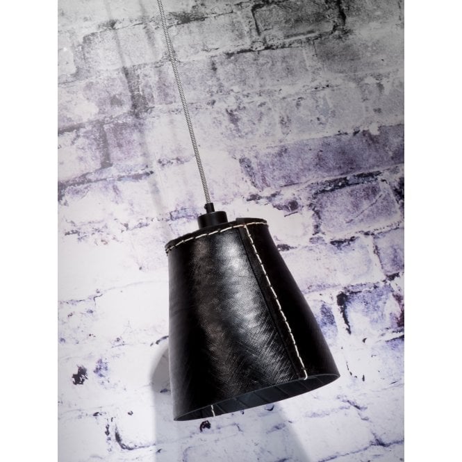 A single tyer pendant light against a white bricked wall.