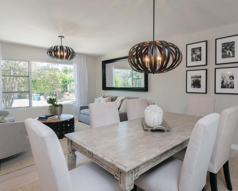 Two ceiling lights in an open plan living and dining room.