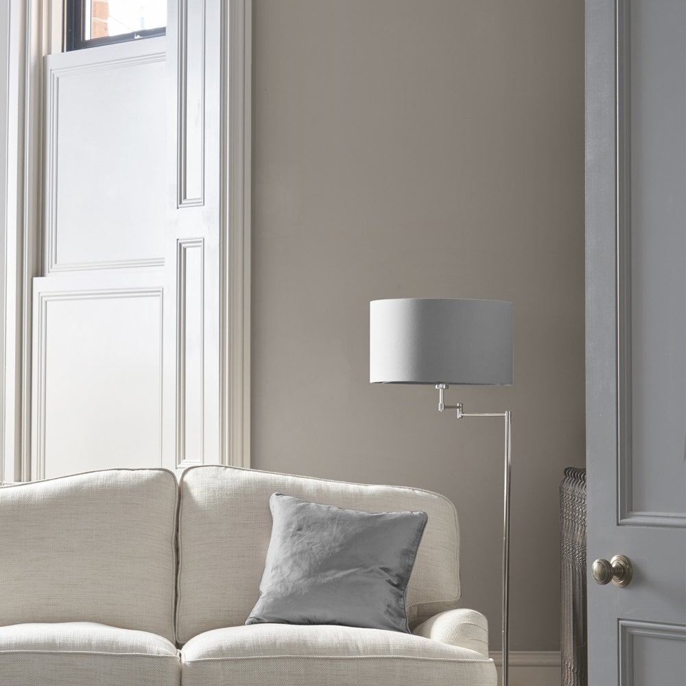 front room with a sofa and floor lamp