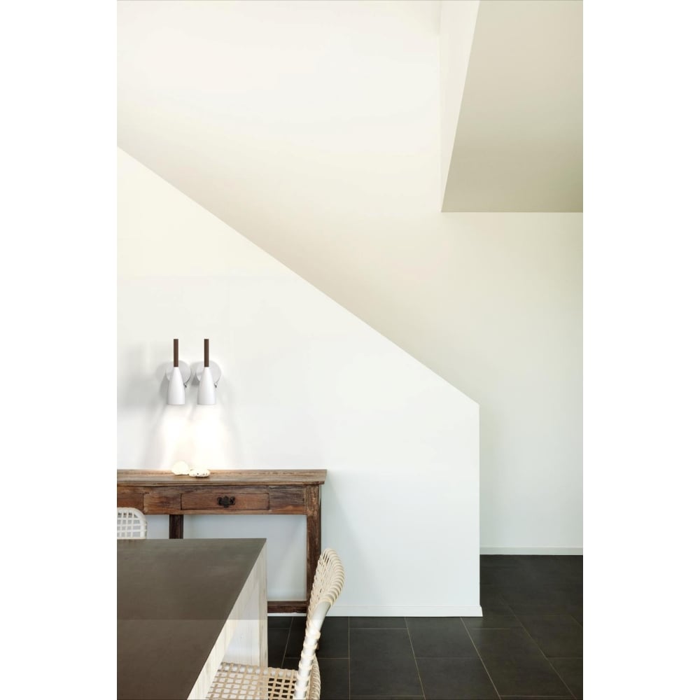 Scandinavian design inspired kitchen and dining area with two wall lights