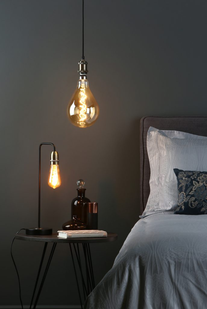 Table Lamp Black & Antique Brass with bare bulb paired with a single ceiling suspension with a oversized decorative bulb
