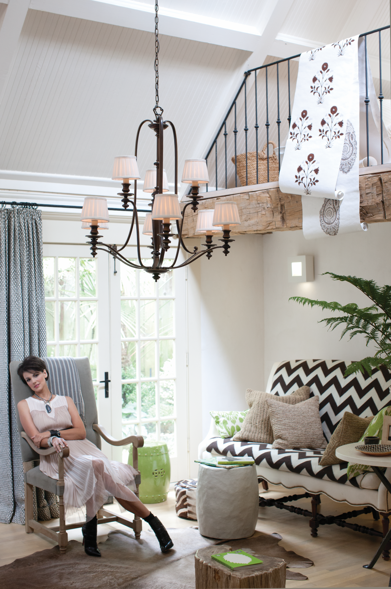 rustic chandelier suspended from a vaulted ceiling