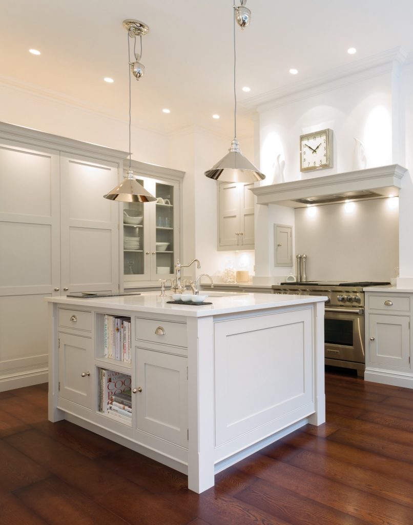 rise and fall ceiling pendants over a kitchen island