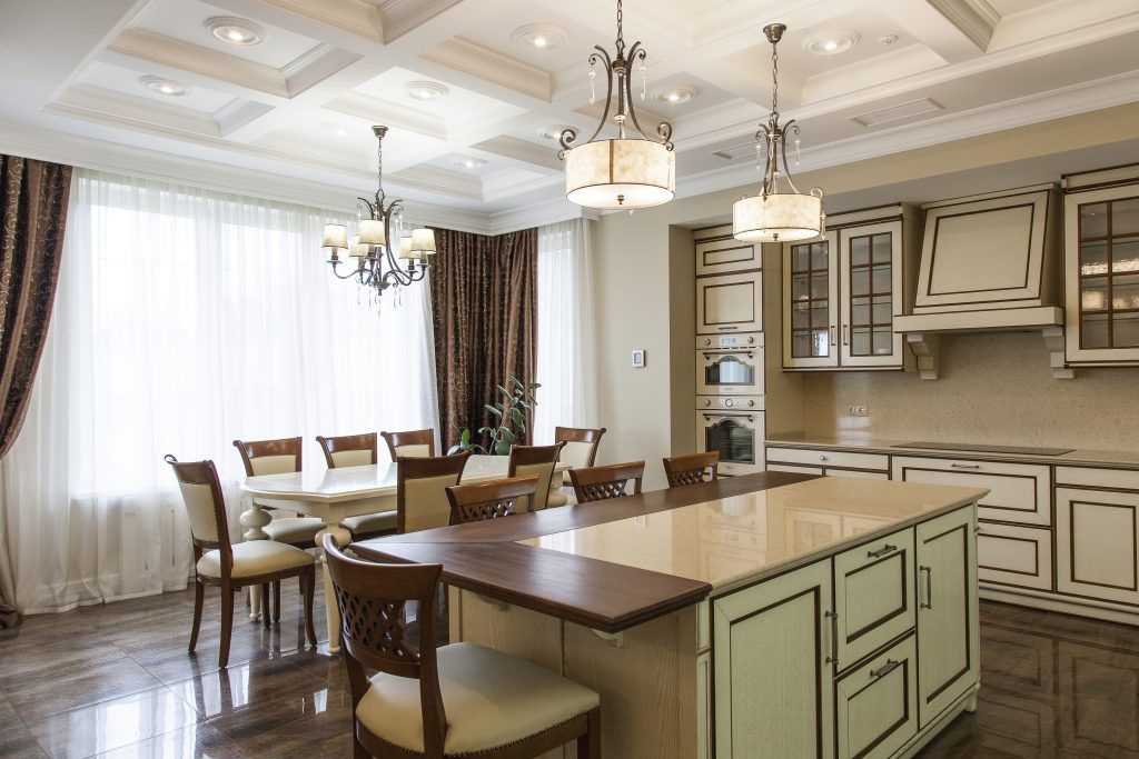 elaborate shaded ceiling lights hanging from a beamed ceiling