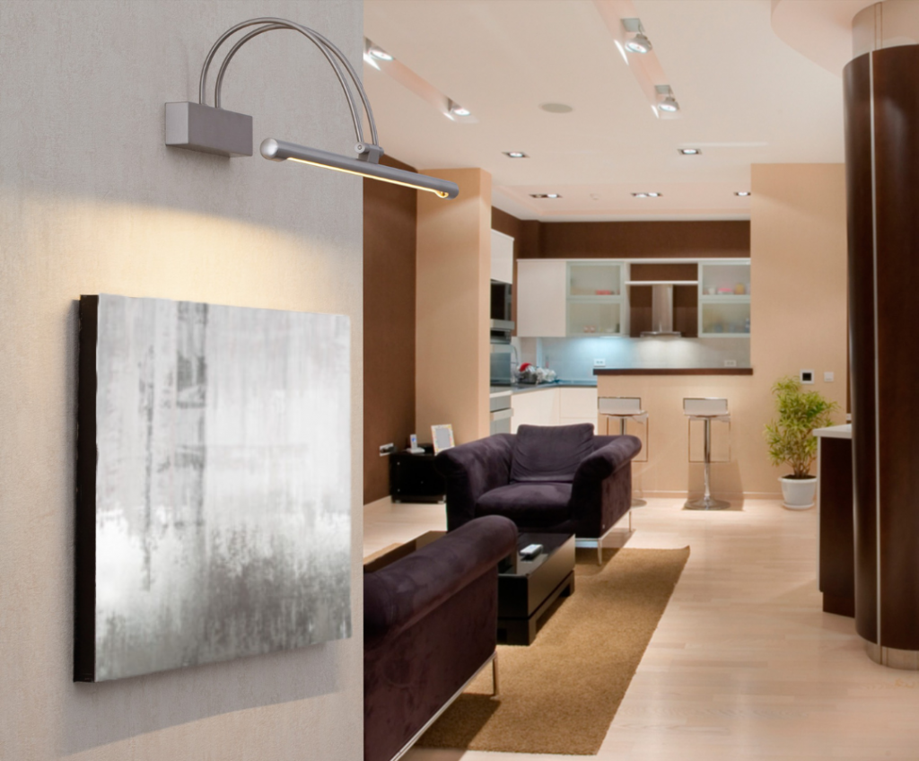 silver picture light with curved arm hanging over silver canvas in home living room, purple chairs