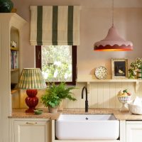Pink pendant light edges with red Red table lamp Green shade.