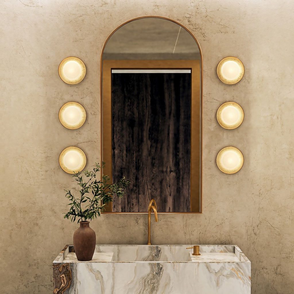 Three lights either side of a bathroom mirror created impact.