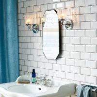 Tiled Bathroom with pair of Lights either side of a mirror