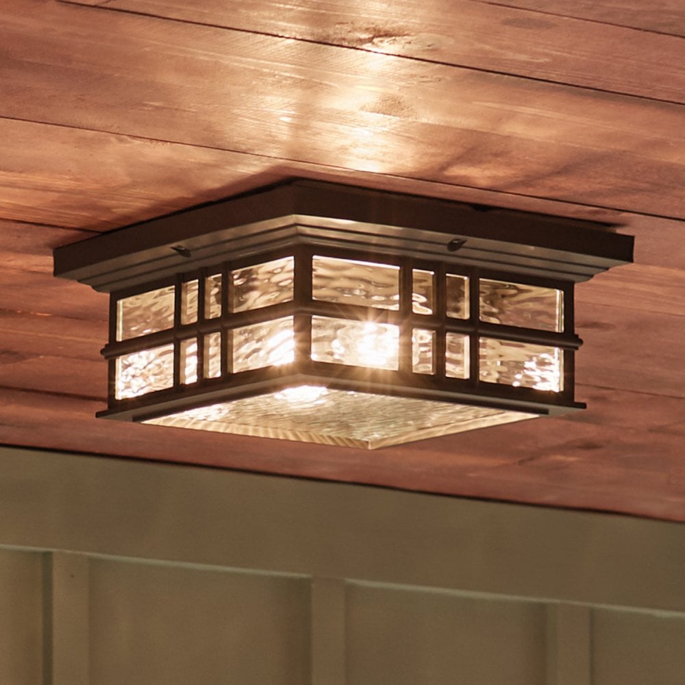 A semi flush ceiling light fitting in a gothic style that would be suited to a medieval house