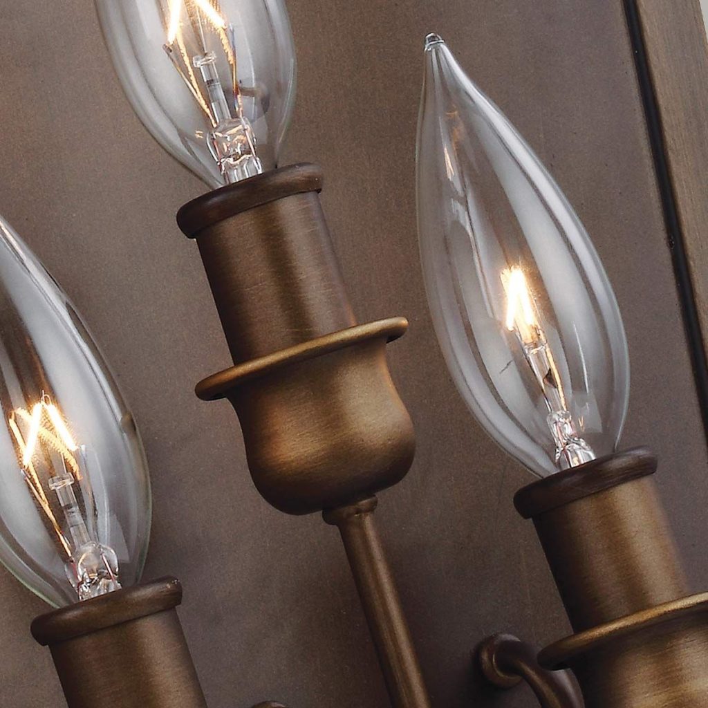 a brass effect lighting fitting with warm candle shaped bulbs