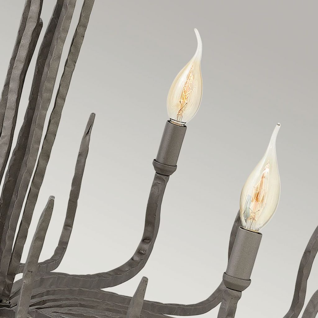 A modern light fitting with an authentic gothic or medieval feel, featuring candle styles bulb fittings
