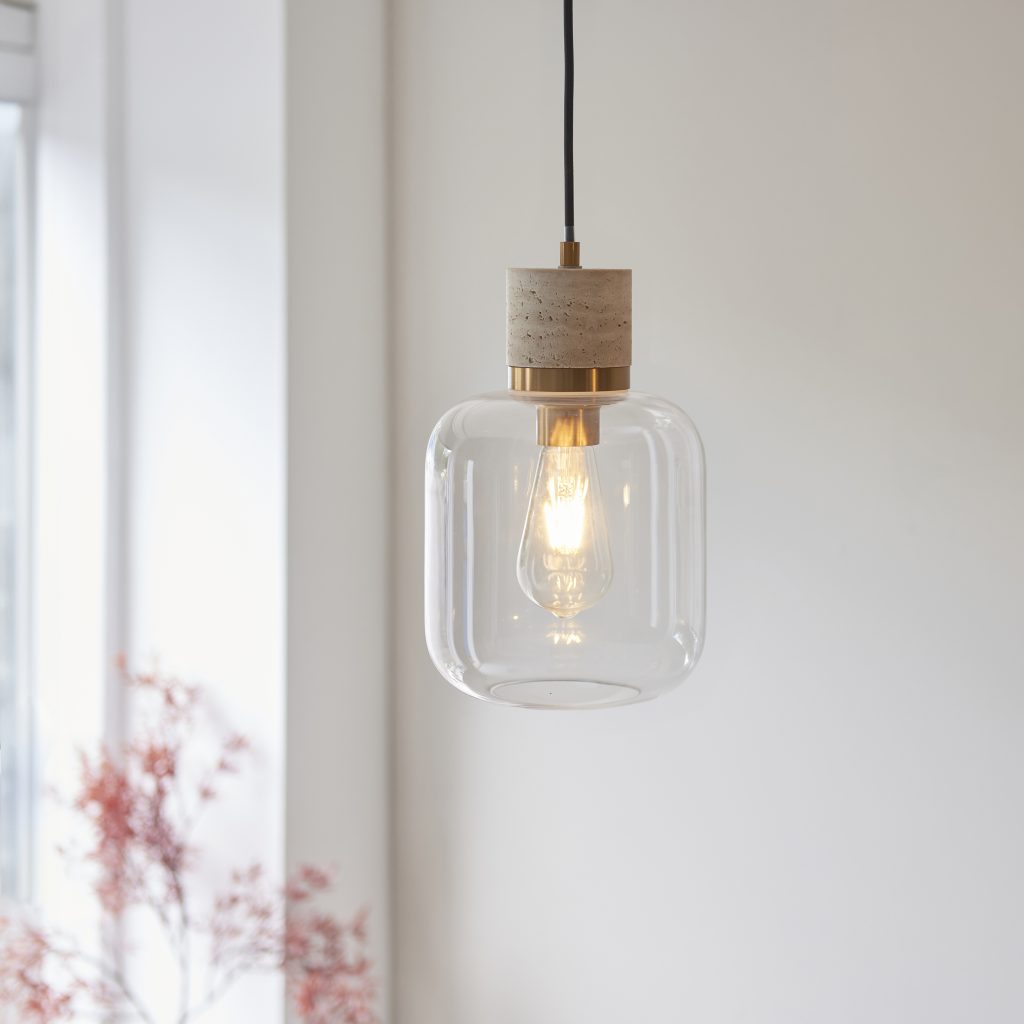 a stone ceiling pendant and glass shade