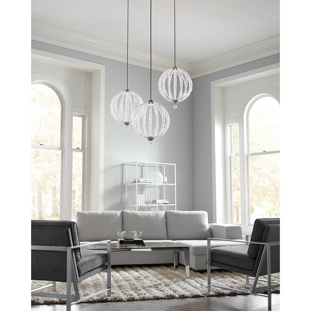 three large globe hanging pendants in a light and airy living room