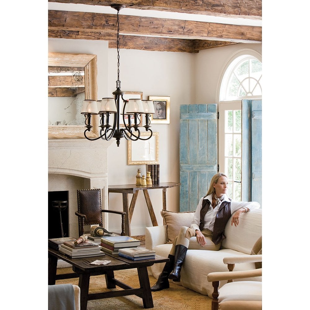 a large ornate chandelier hanging in a living room area