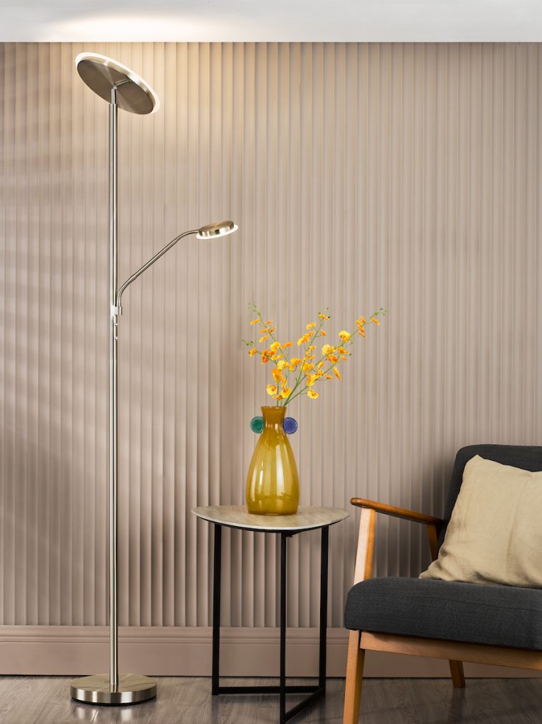 a modern mother and child LED floor lamp in a living room by a side table and arm chair