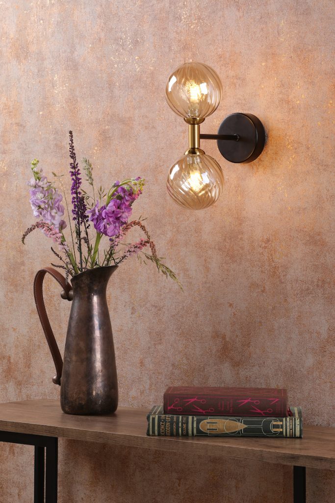 a black and amber glass wall light