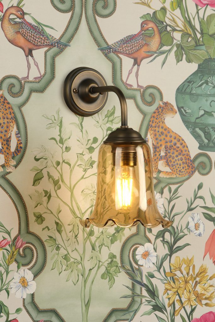an amber glass fluted wall light shade