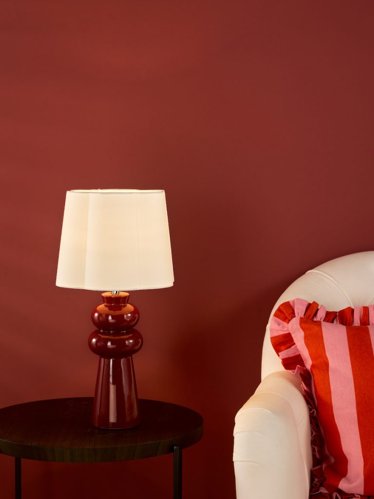 a bold modern pink ceramic lamp with ivory linen shade