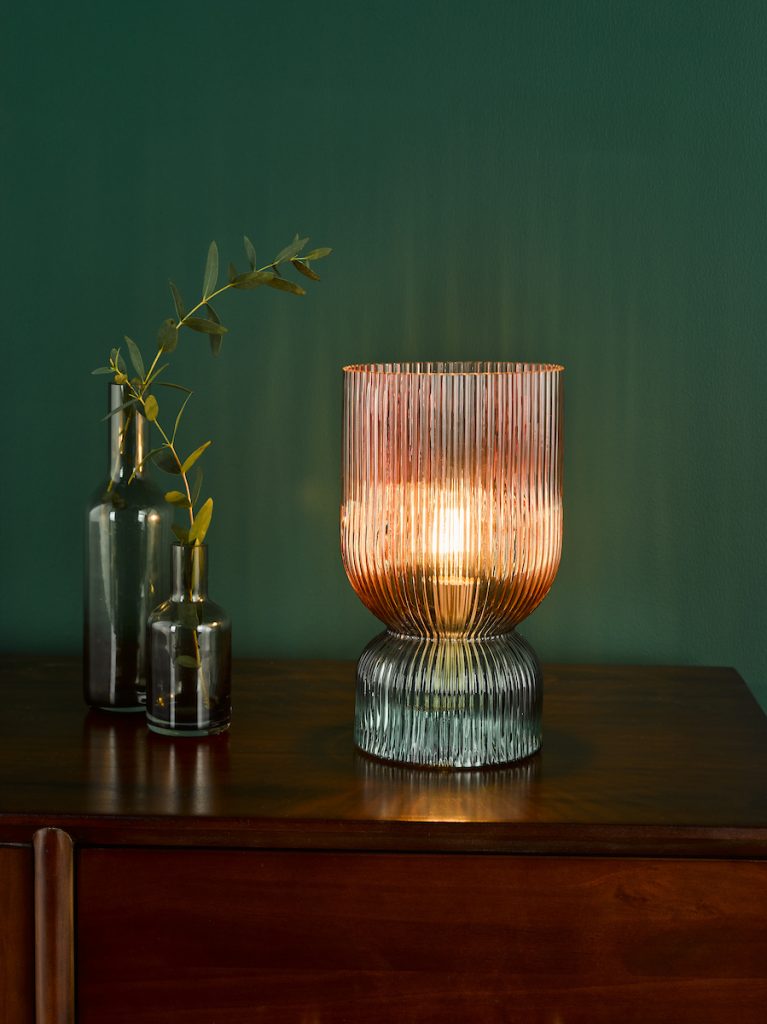 a ribbed glass decorative table lamp finished in pink and green