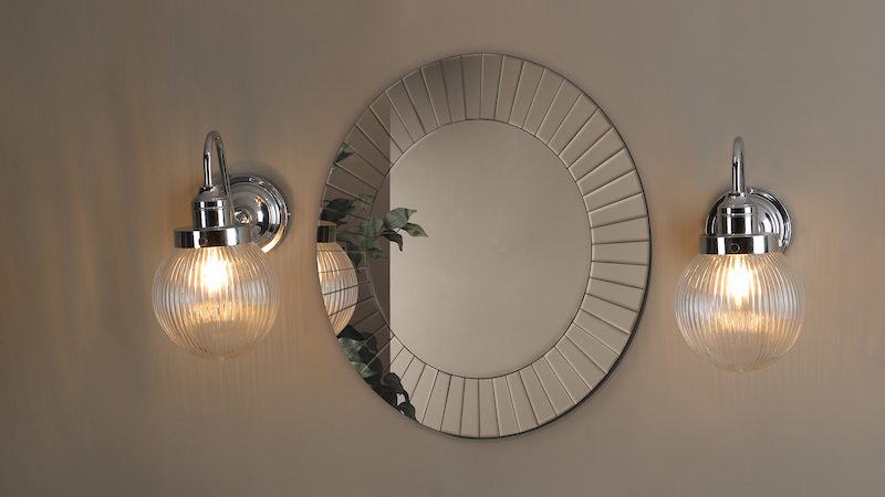 modern chrome bathroom wall lights paired with a mirror
