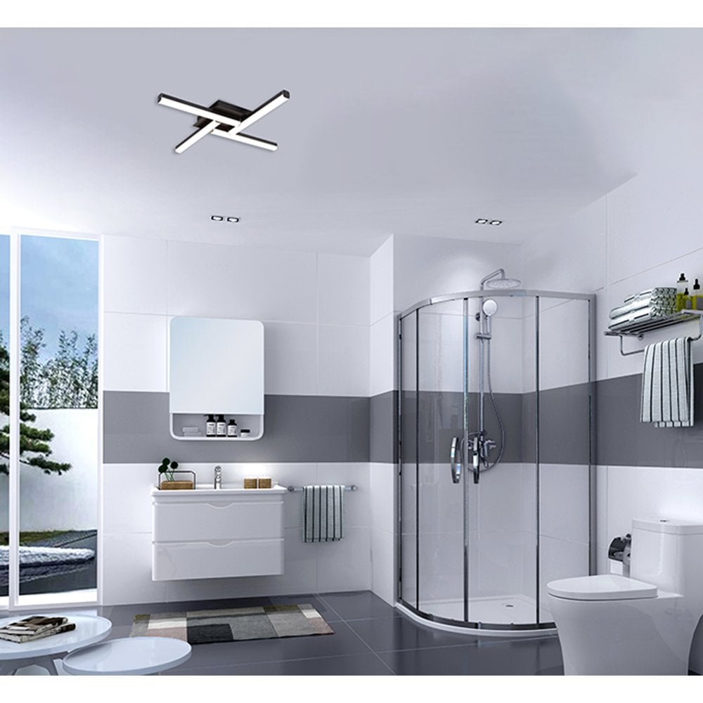 a modern bathroom with sleek slim profile black and LED lights
