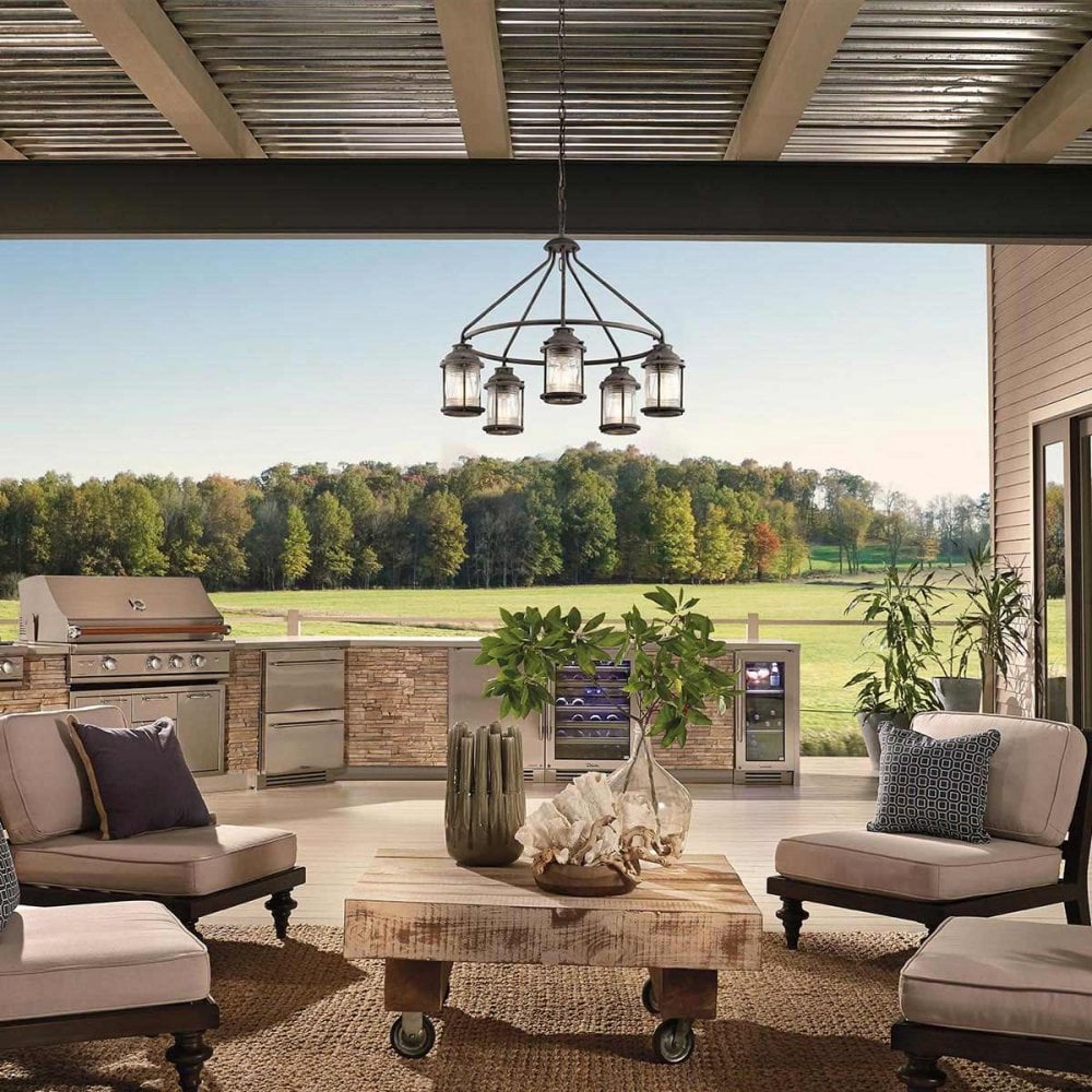 a lantern style chandelier in an outdoor seating area