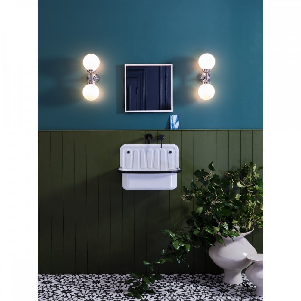 heritage style bathroom with a pair of matching opal glass wall lights