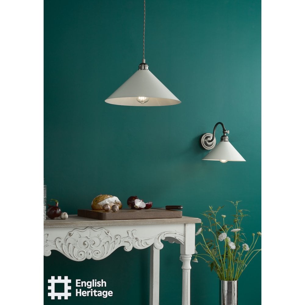 a rubbed bronze pendant and wall light with cream enamel shade in a kitchen environment