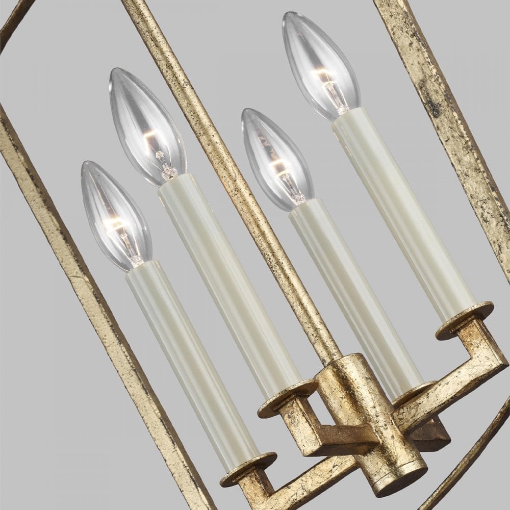 an open modern distressed brass lantern style pendant light with tall candle type bulbs which adds modern flair to a traditional style light