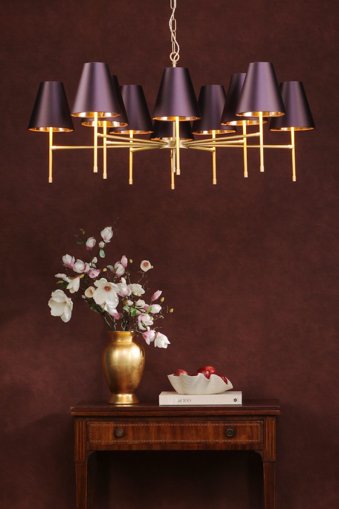 a modern multi arm pendant with purple tapered lampshades