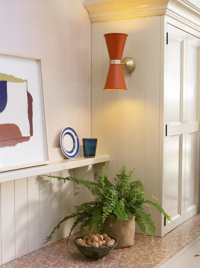 wall Light in burnt orange to make art work in the space