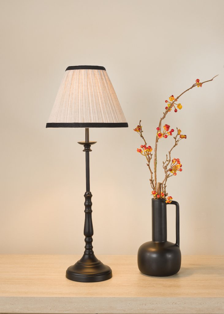modern black table lamp with ivory tapered, pleated lampshade with black trim detail