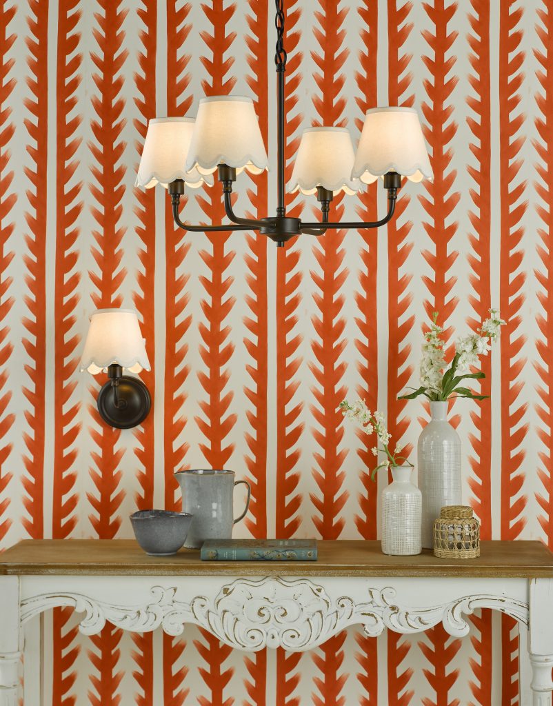 Black Light against orange wall covering contrasting perfectly