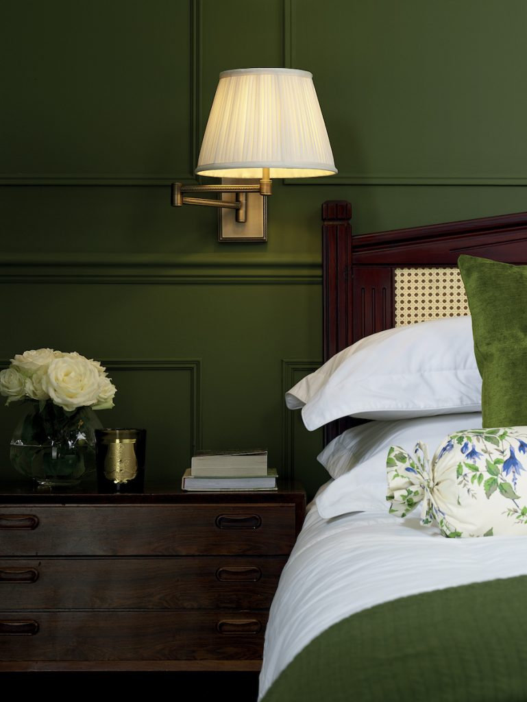 a bedside swing arm adjustable wall light