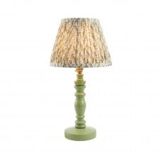 green table lamp with green leaf patterned shade