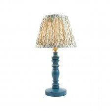 blue table lamp with green leaf pattern shade