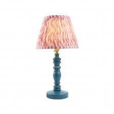 blue wooden table lamp with pink ripple pattern shade