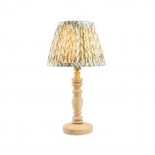 wooden table lamp with green leaf pattern shade