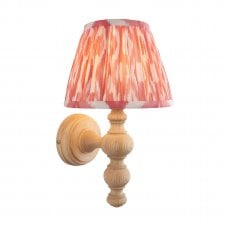 wooden wall light with coral pink ikat pattern shade
