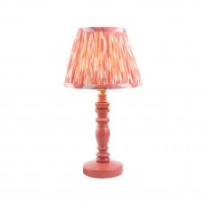 pink wooden table lamp with coral pink ikat pattern shade