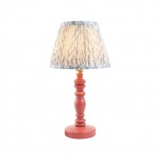 pink table lamp with blue leaf pattern shade