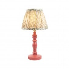 pink table lamp with green leaf pattern shade