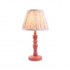 pink wooden table lamp with peach leaf patterned shade
