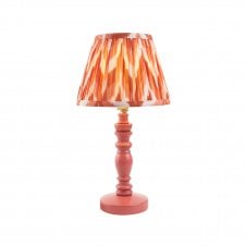 pink wooden table lamp with orange zigzag pattern shade