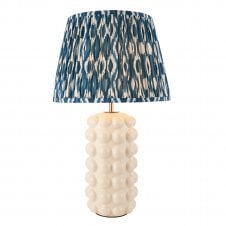white ceramic table lamp with blue ikat pattern shade