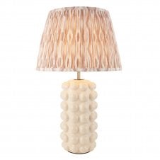 white ecramic table lmap with neutral ikat patterned shade